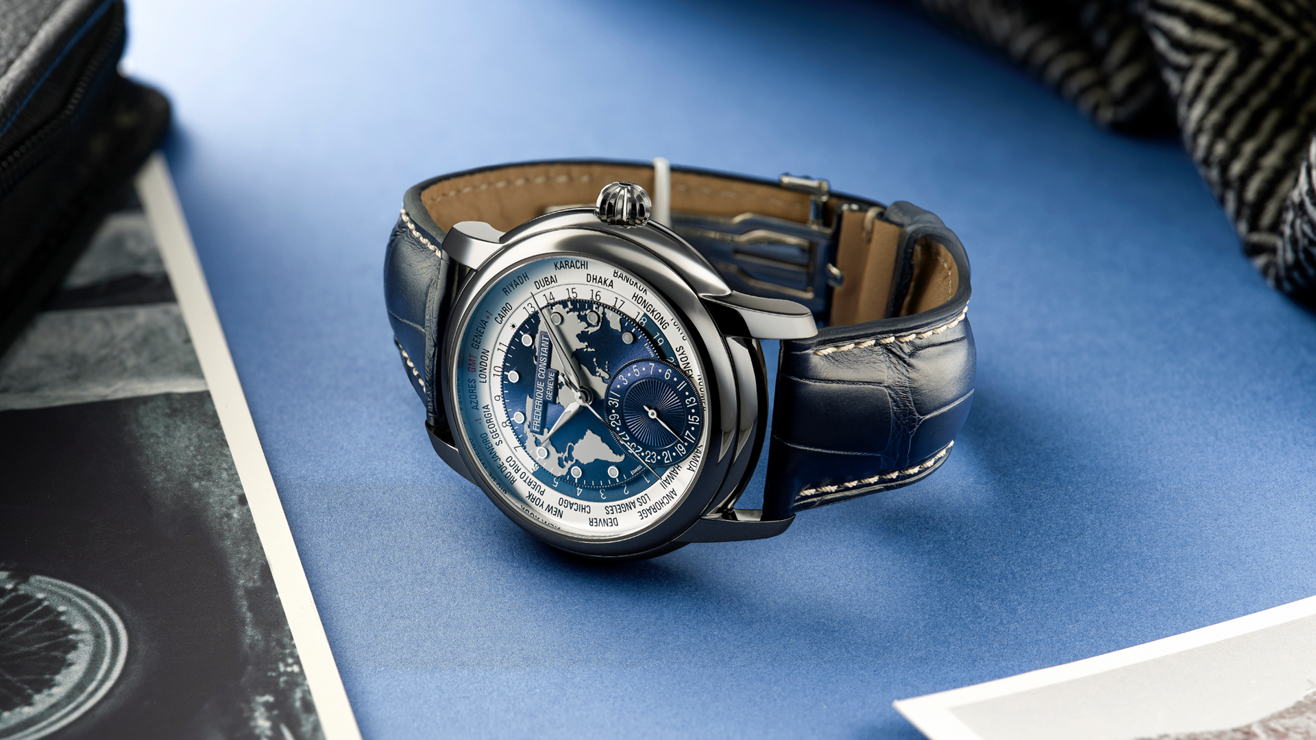 Worldtimer Manufacture watch for man. Automatic movement, grey and blue dial, stainless-steel case, date counter, worldtimer and blue leather strap