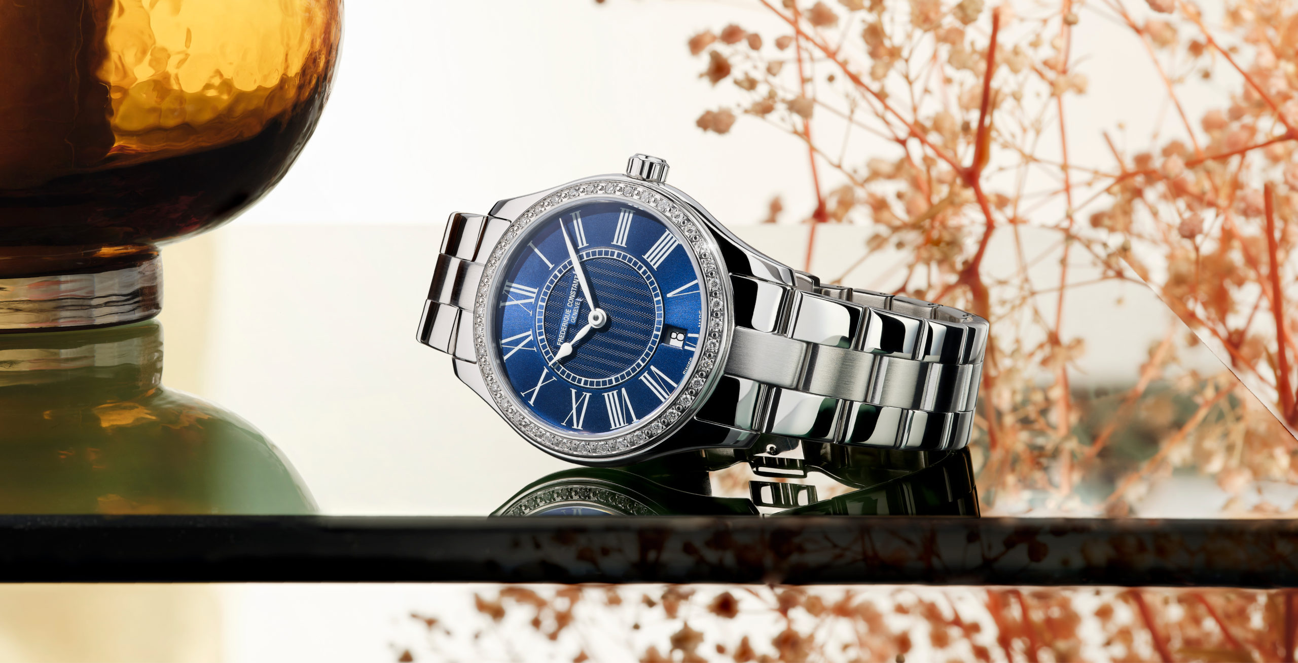 Classics Ladies Quartz watch for woman.   Quartz movement, blue dial, stainless-steel case with 40 diamonds, date window and stainless-steel bracelet 
