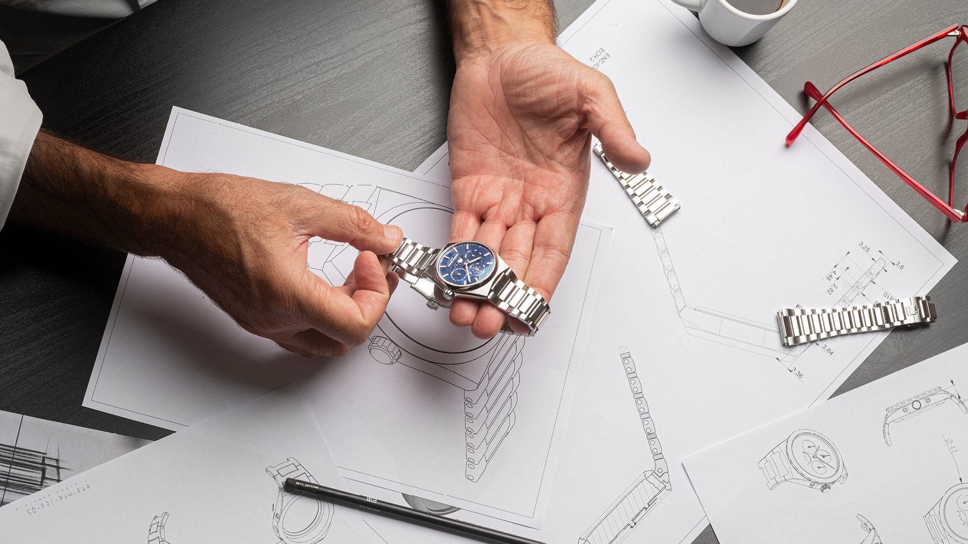 Highlife Perpetual Calendar Manufacture watch for man.   Automatic movement, blue dial, stainless-steel case, date, month and day counters, moonphase and stainless-steel integrated and interchangeable bracelet 
